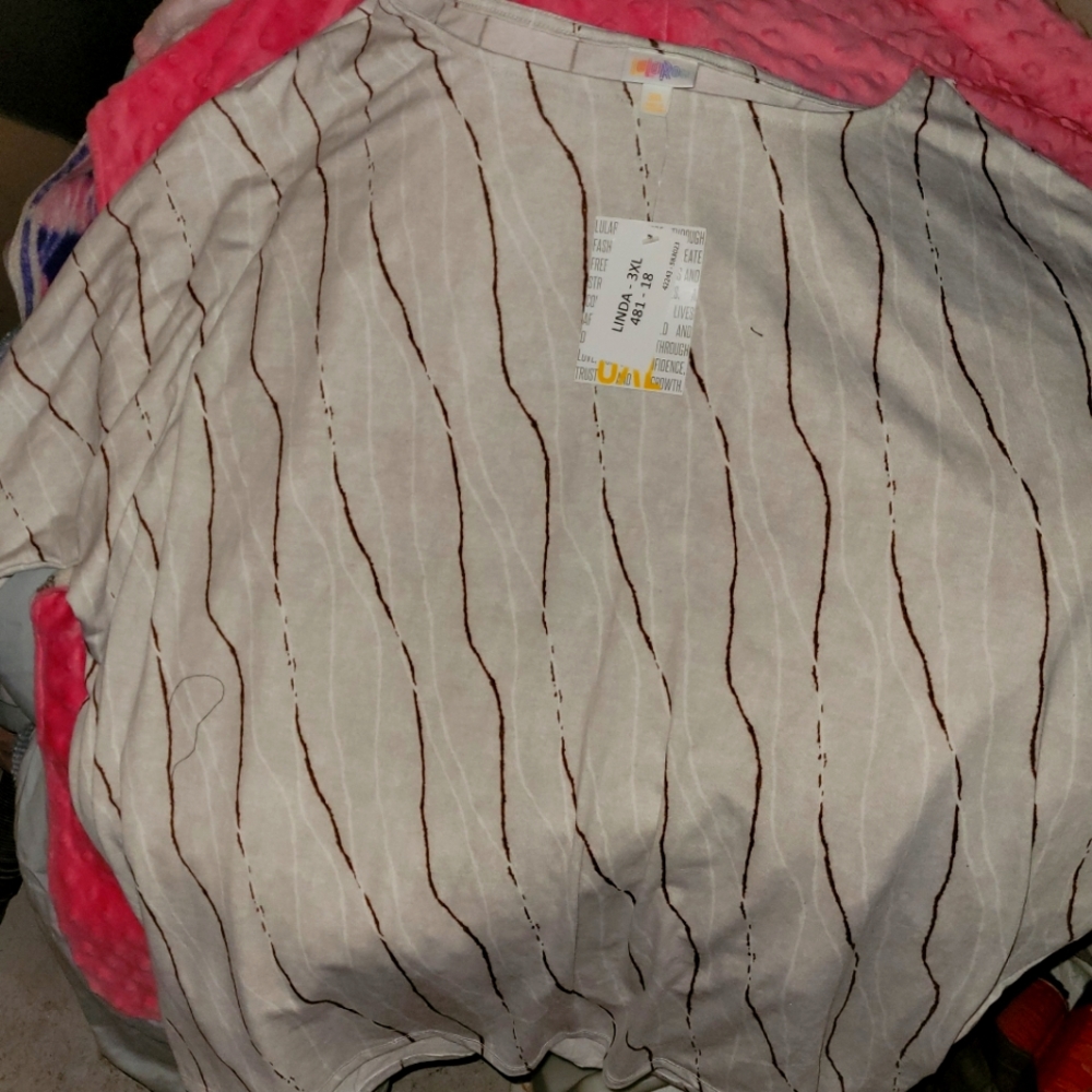 Lularoe short sleeve top. Tan with red Striped pattern.